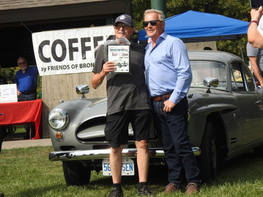 Johnny Herbert awards Peter Brook with best of show award at 2023 British Car Day