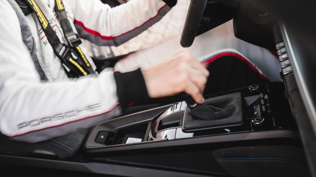 Jörg Bergmeister's hand on stick shift