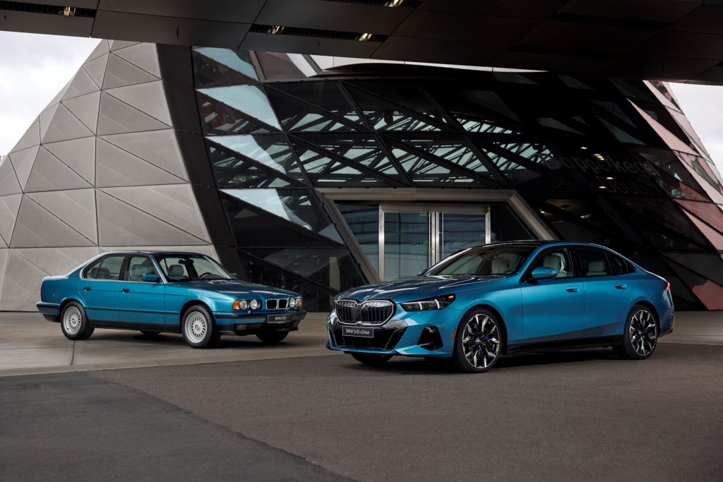 Old BMW 540i beside 2026 BMW 540i xDrive Legacy Edition