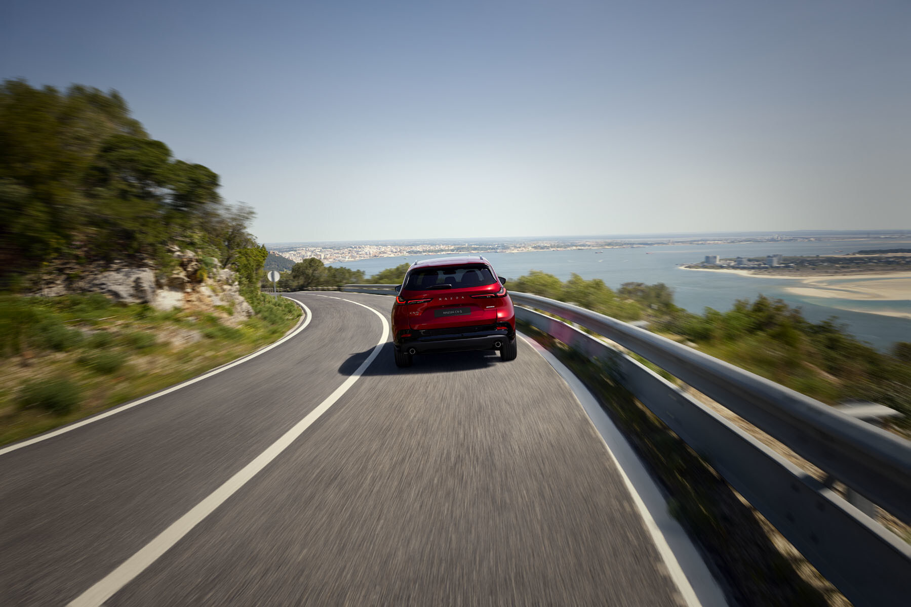 2026 Mazda CX-5 driving on seaside road