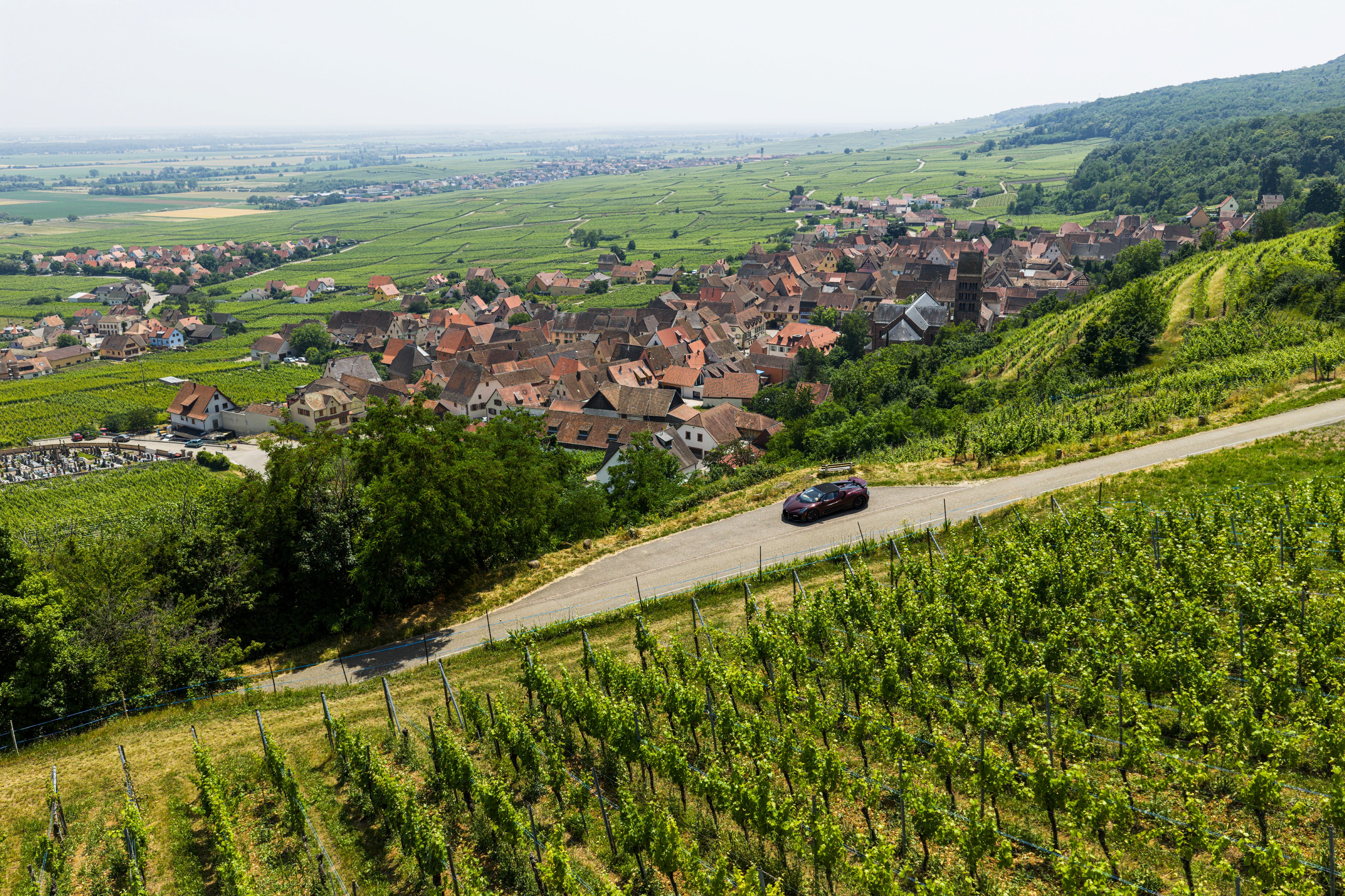 Bugatti W16 Mistral with village in background