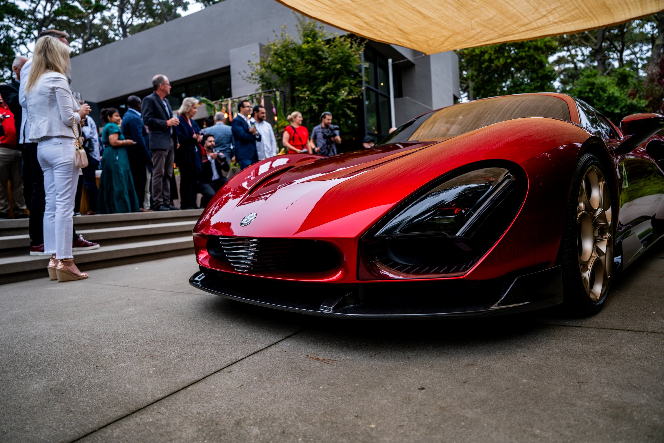 Alfa Romeo 33 Stradale surrounded by guests at Hagerty House