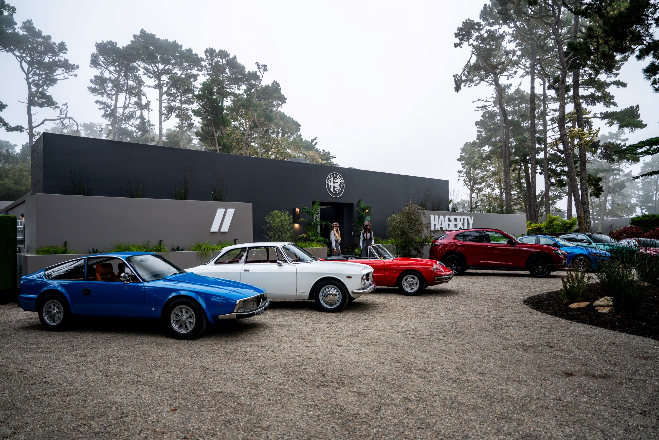 Classic and new Alfa Romeo cars outside Hagerty House