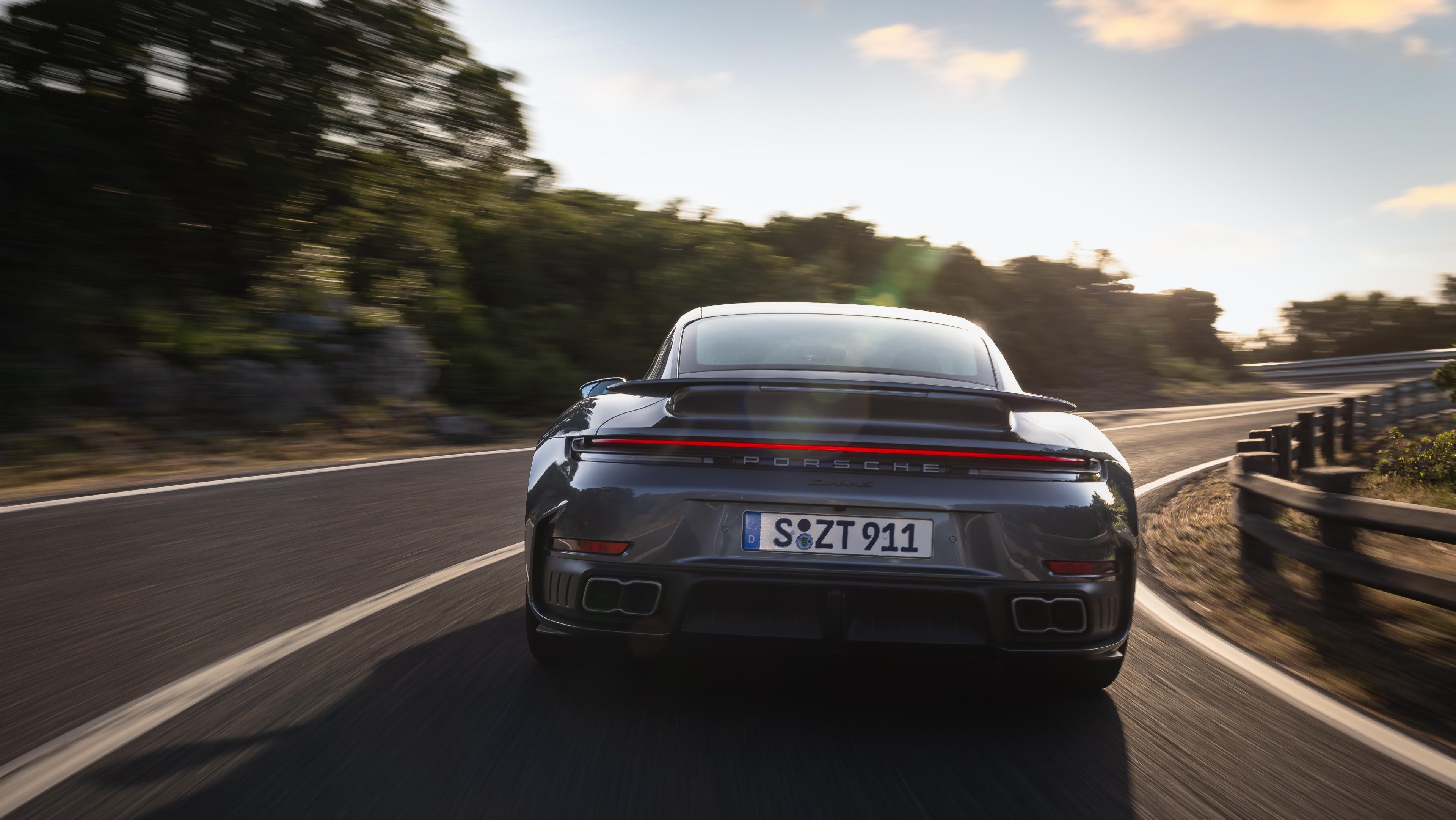 Porsche 911 Turbo S driving from behind