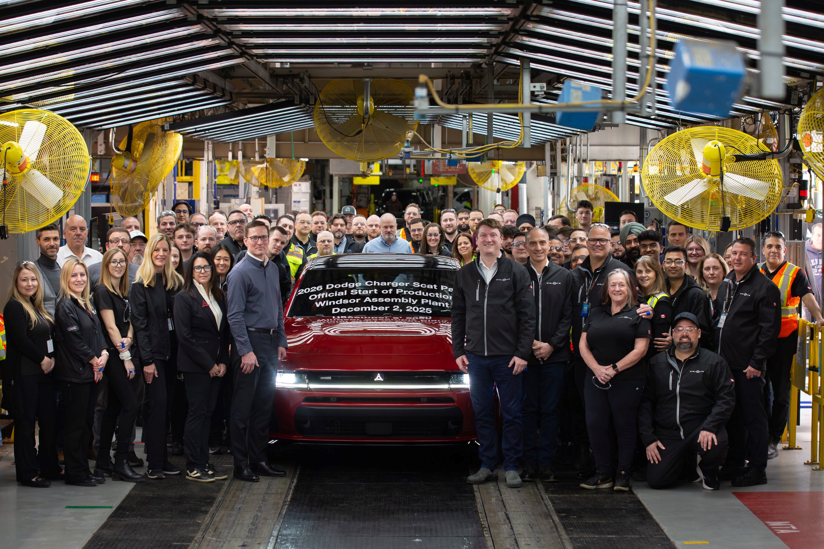Stellantis employees at Windsor assembly plant with 2026 Dodge Charger Scat Pack
