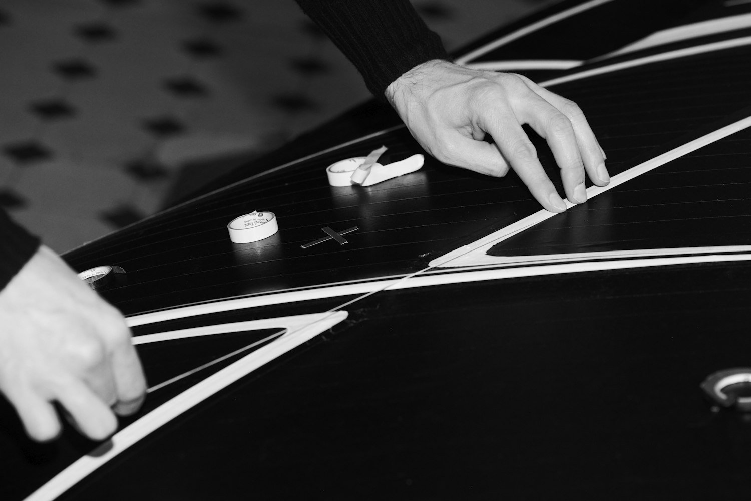 Designer applies tape to Bugatti W16 Mistral La Perle Rare