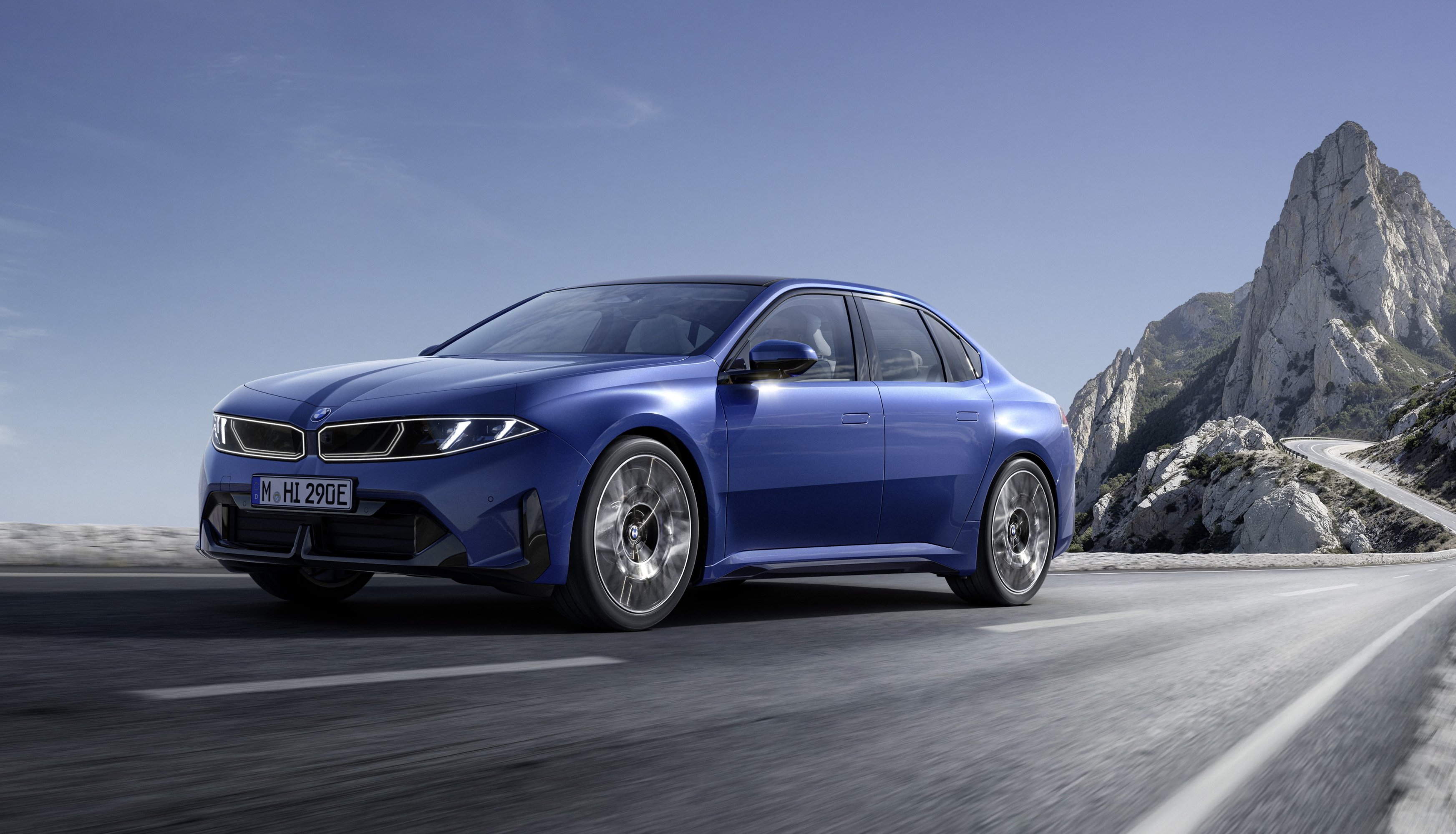 2027 BMW i3 driving front and side