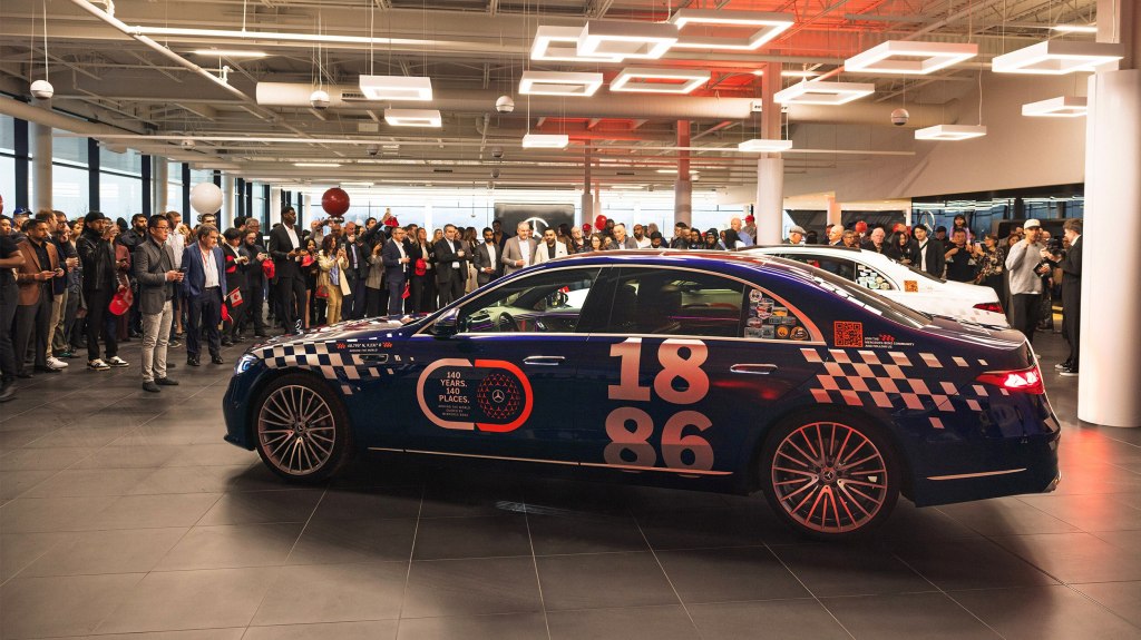 Mercedes-Benz S-Class cars surrounded by people at Mercedes-Benz Toronto Queensway