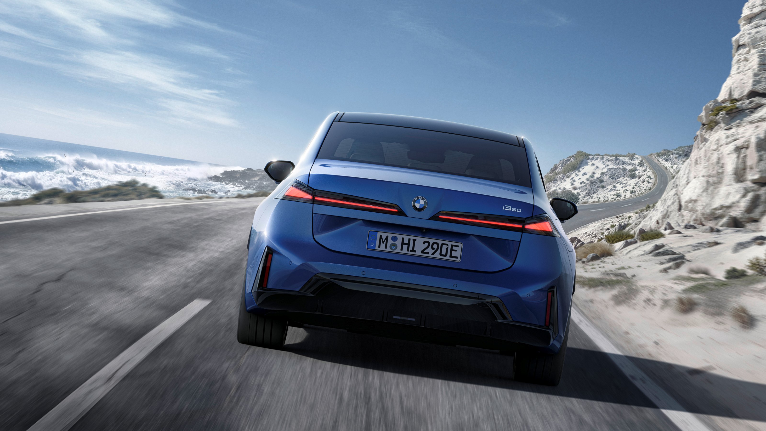 2027 BMW i3 driving rear