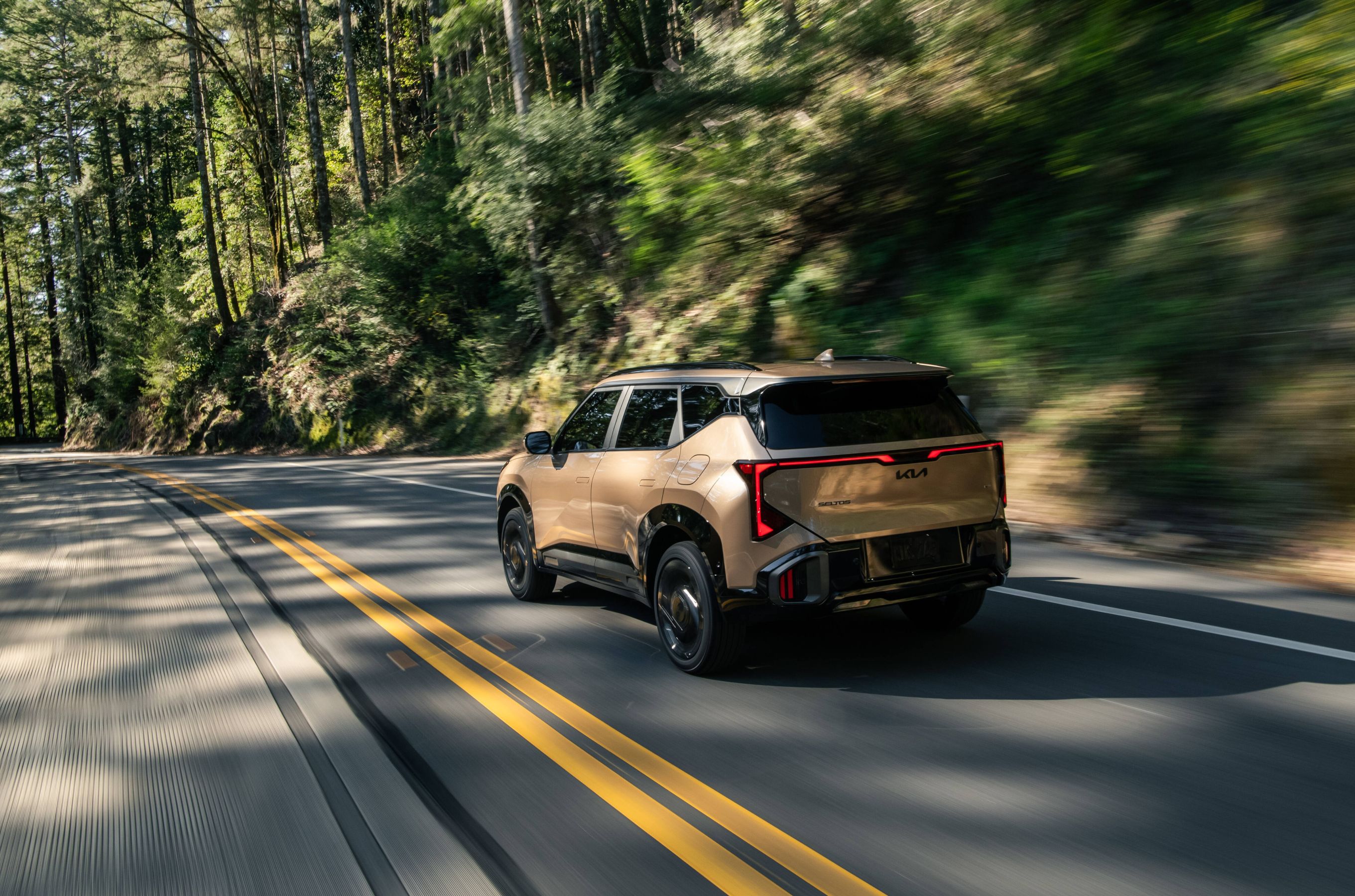 2027 Kia Seltos driving rear