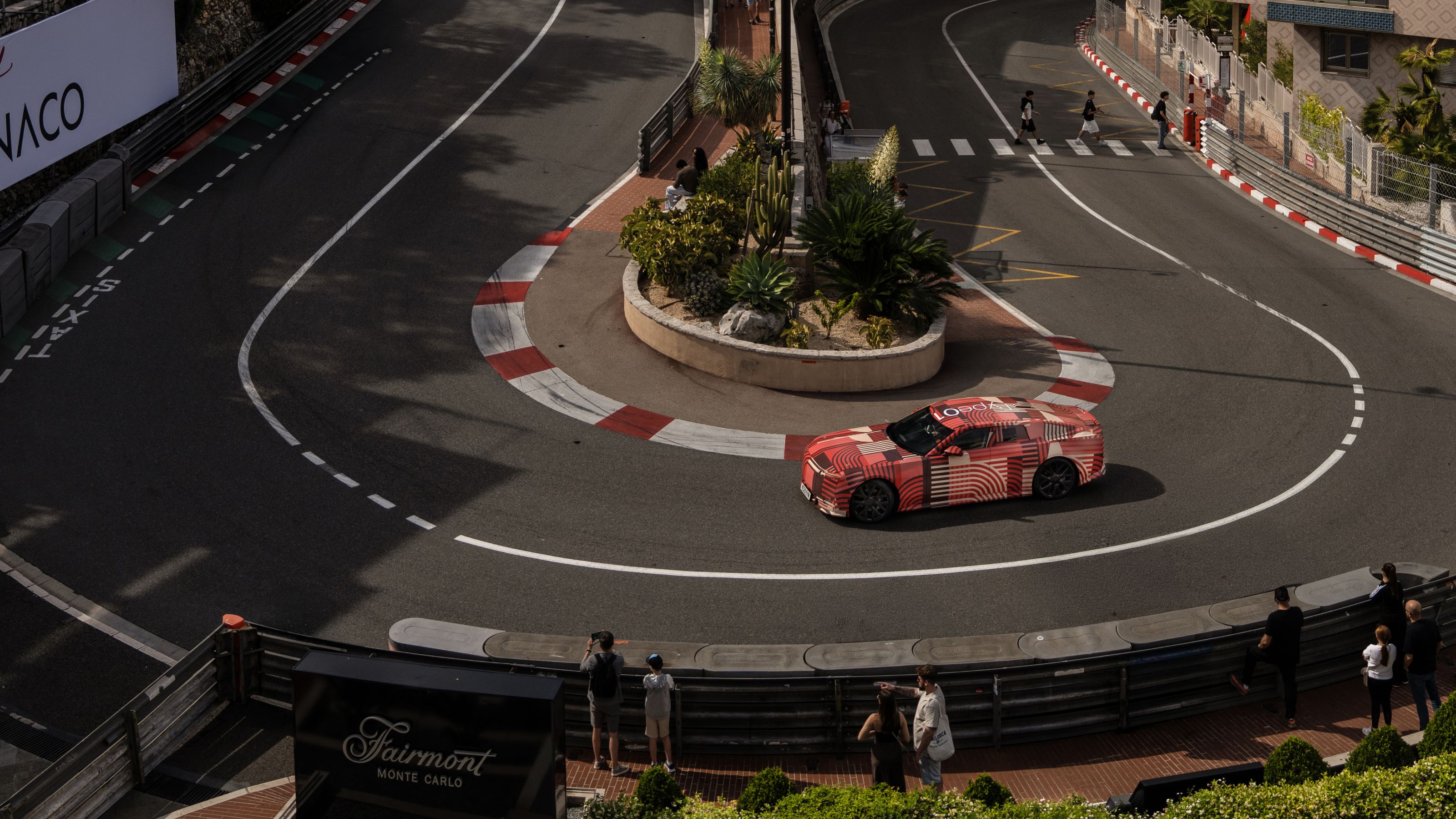 Camouflaged Jaguar Type 01 prototype in hairpin turn