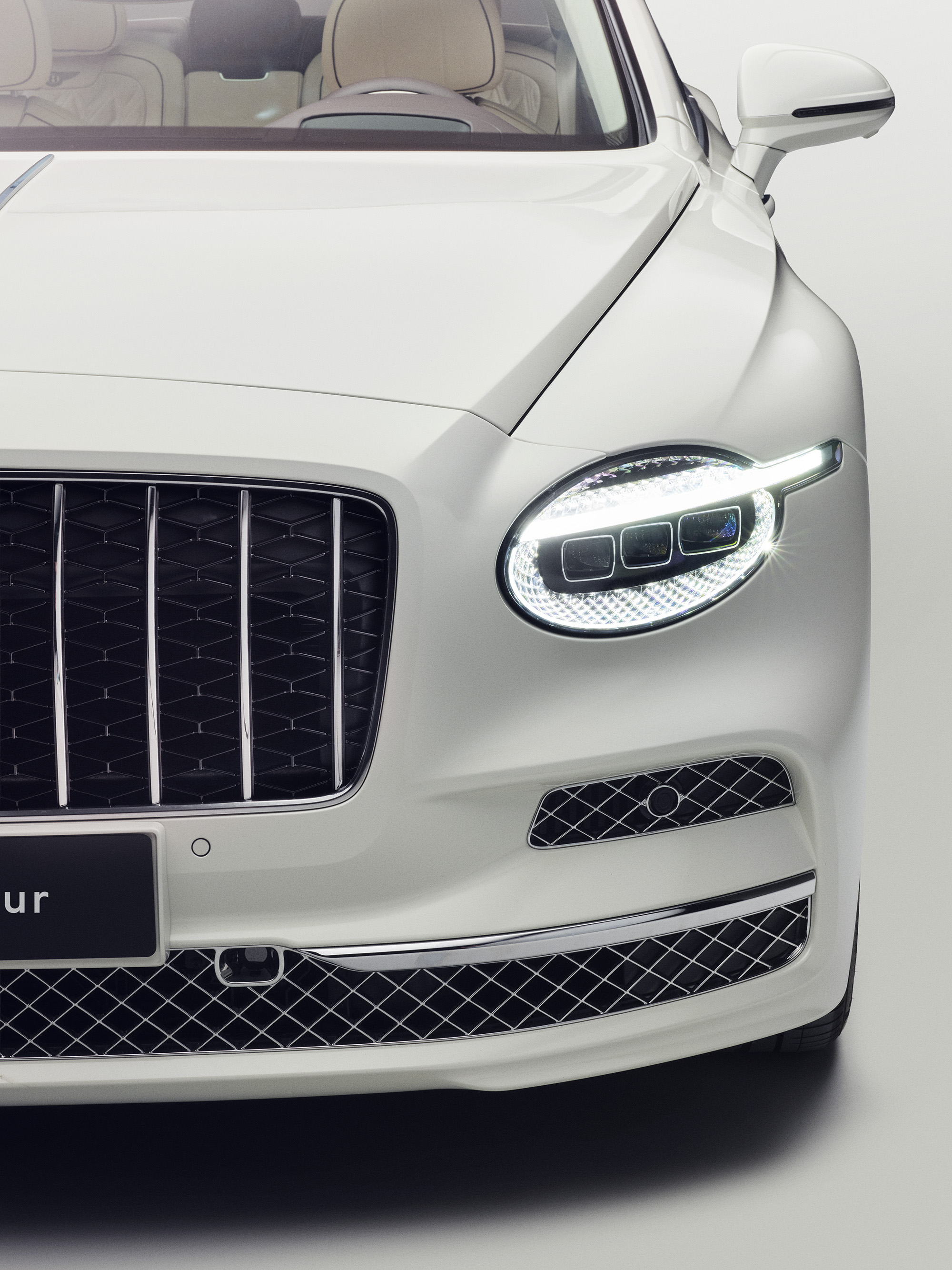 Bentley Flying Spur Azure close up of headlamp