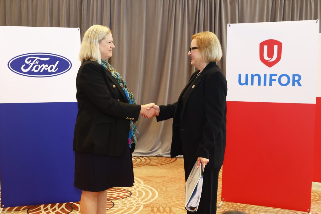 Meredith Keenan and Lana Payne shaking hands