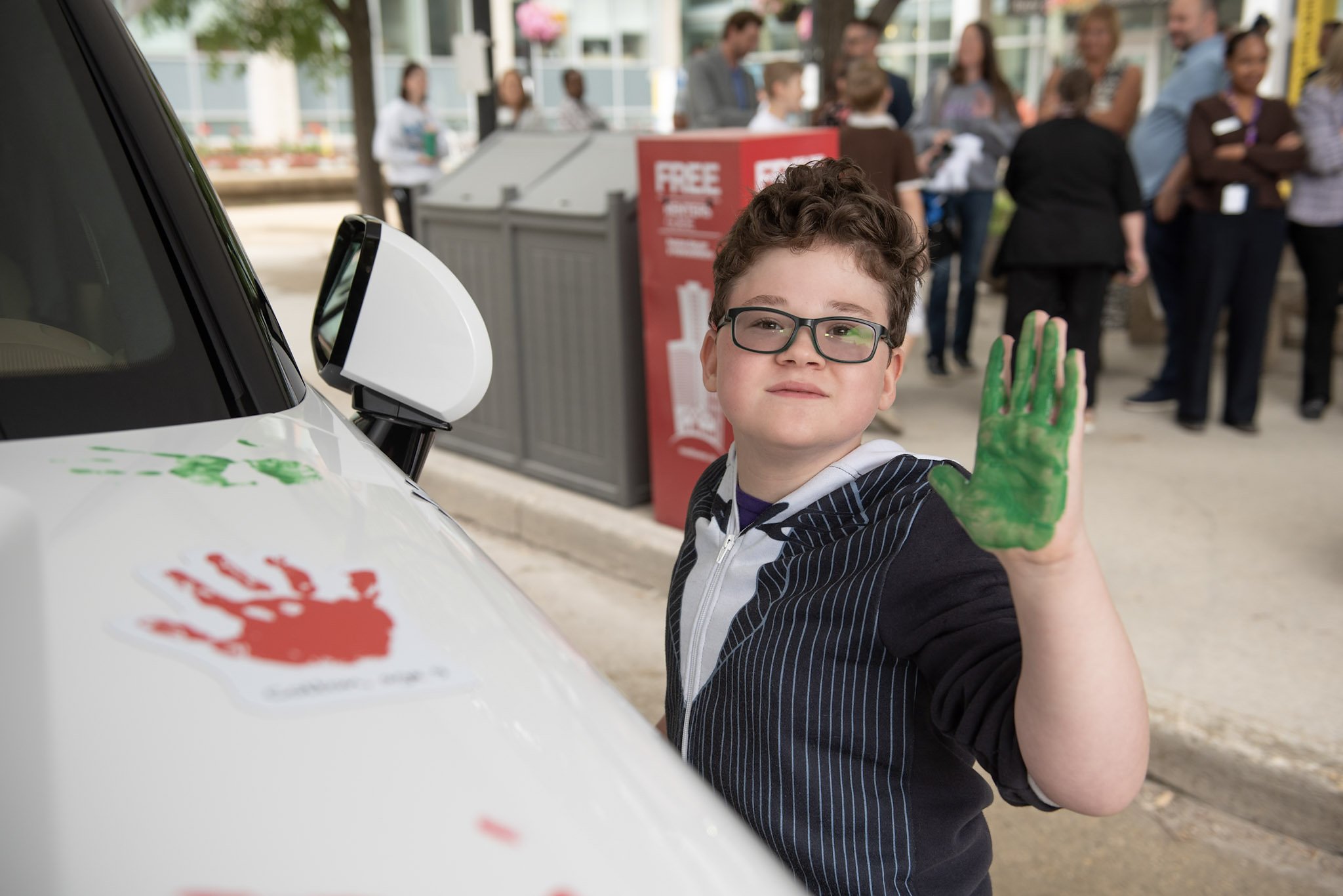 Boy with green handprint