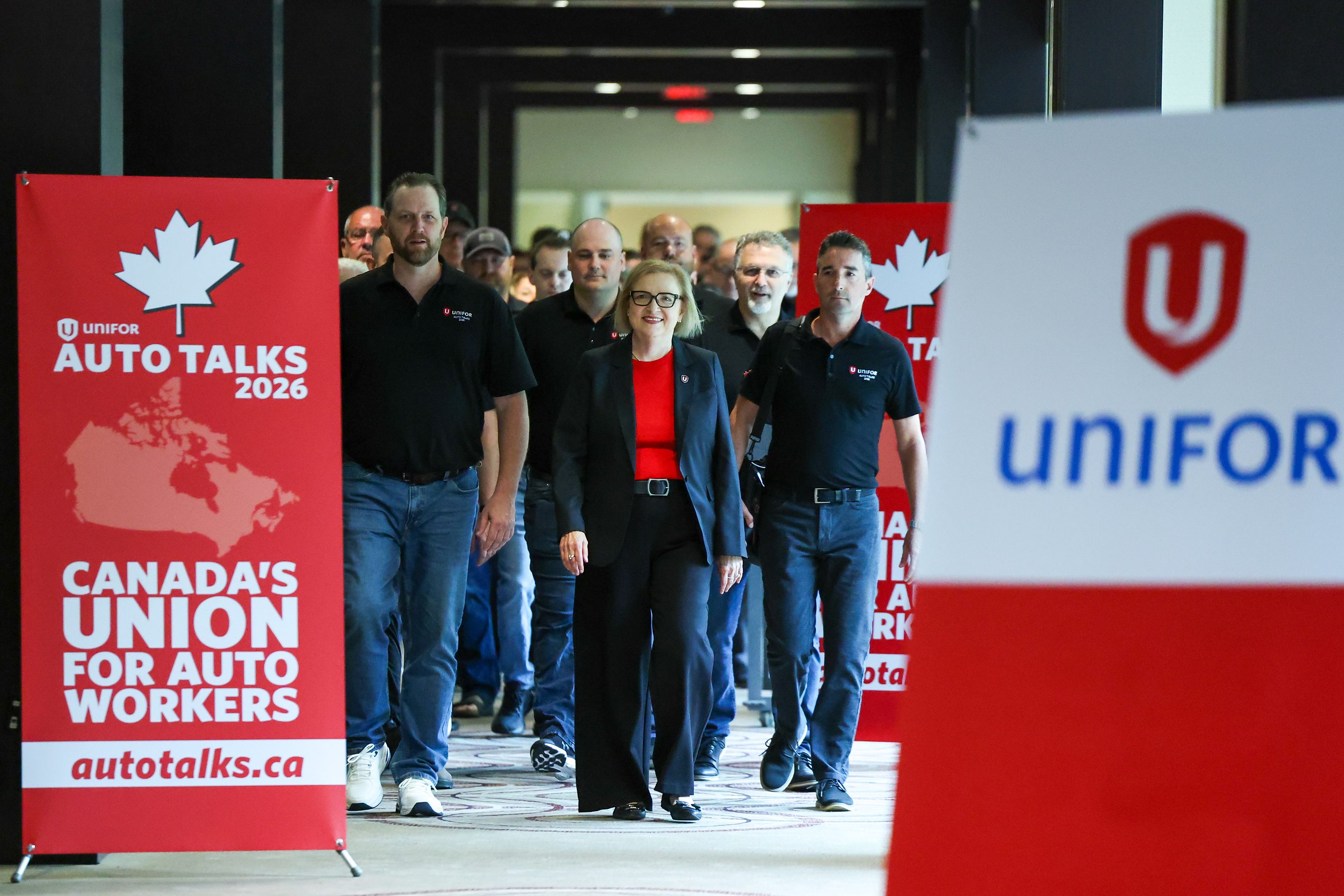 Unifor's General Motors master bargaining committee, with national president Lana Payne