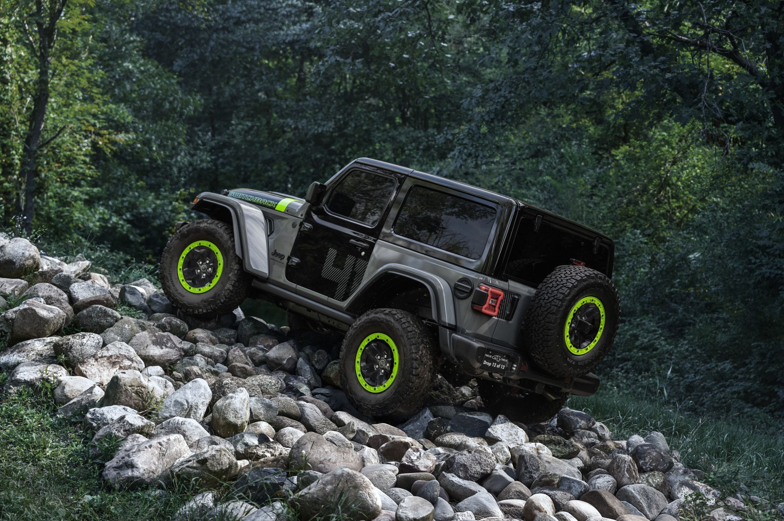 2027 Jeep Wrangler Switchback two-door going up rocks