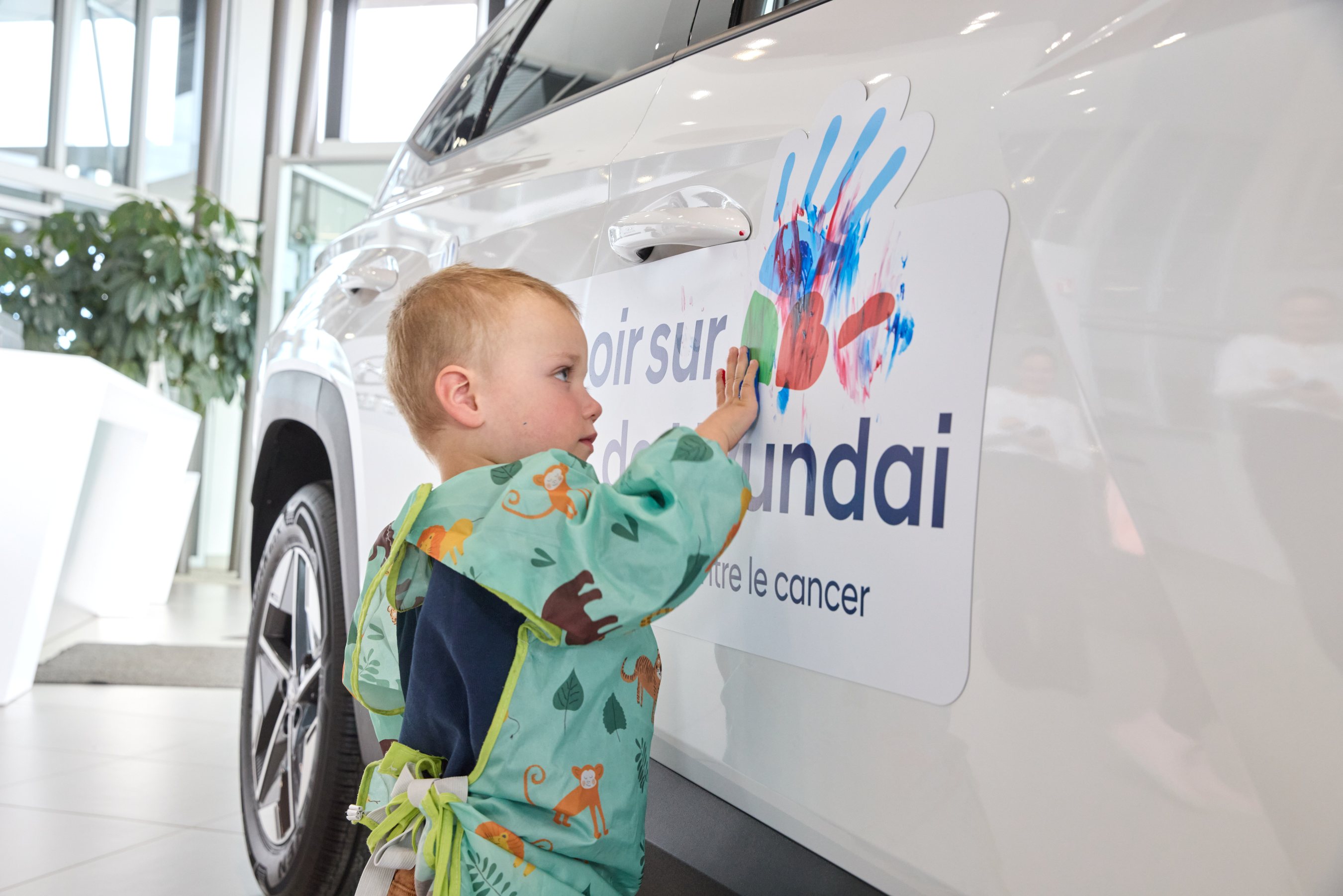Child places handprint on Hyundai vehicle