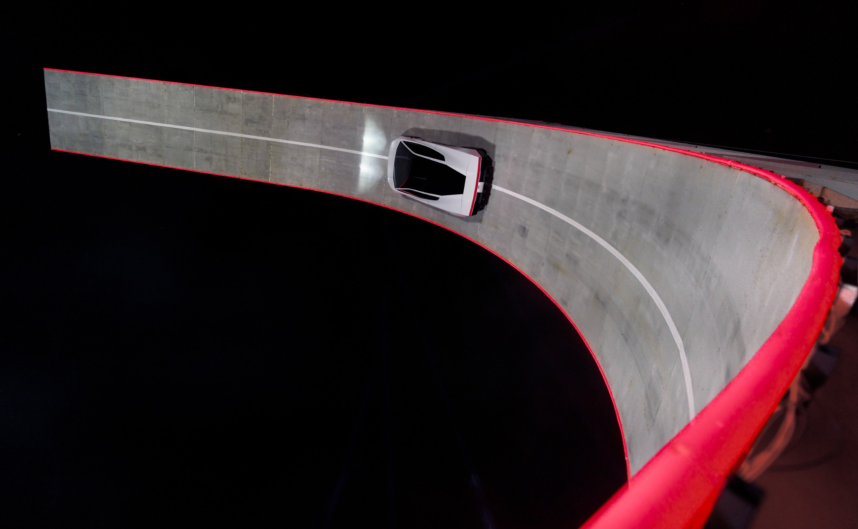 Tesla Roadster upside down on ramp